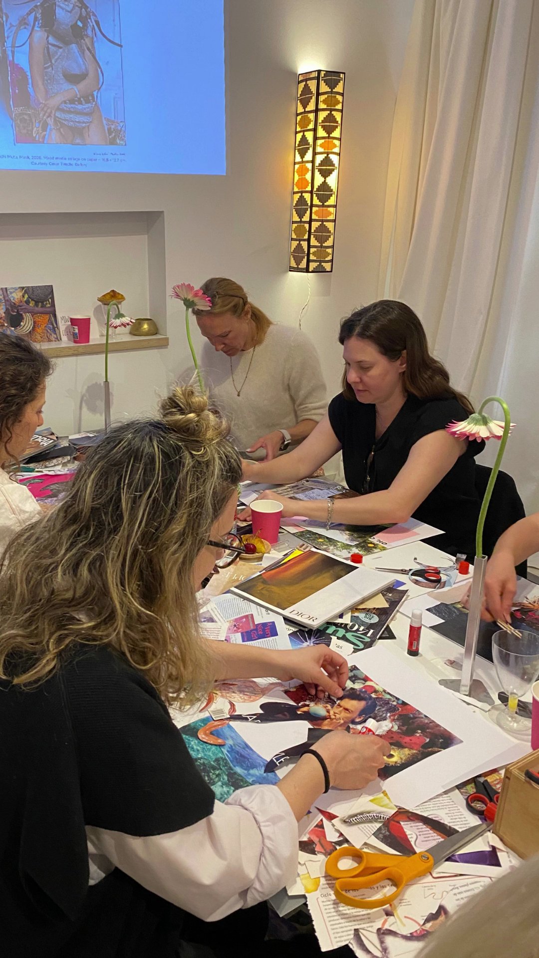 Participants collaging together in a Vera Korman workshop